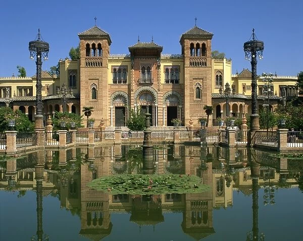 Reflections in the lily pond of buildings on the Plaza de Espana in the city of Seville