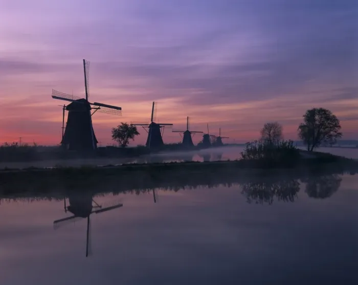 Framed Print : Reflections of a line of windmills in a misty landscape at Kinderdjik Framed Print : Reflections of a line of windmills in a misty landscape at Kinderdjik