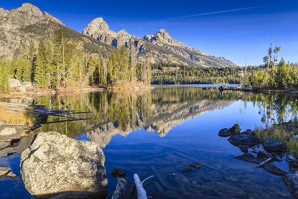 Reflections of the Teton Range in Taggart Lake, Grand Teton National Park, Wyoming, United States of America, North America