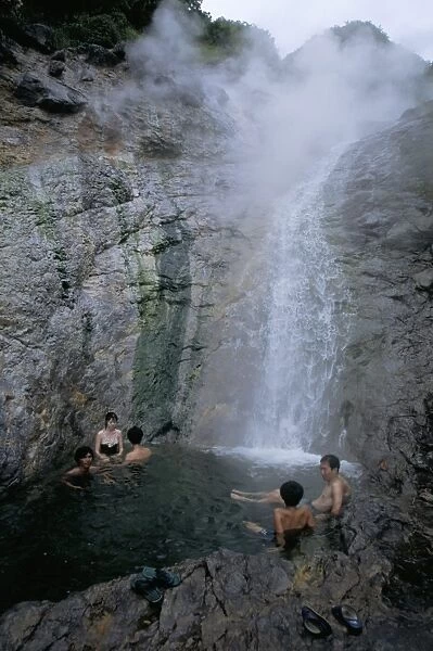 Relaxing in volcanic hot water waterfall