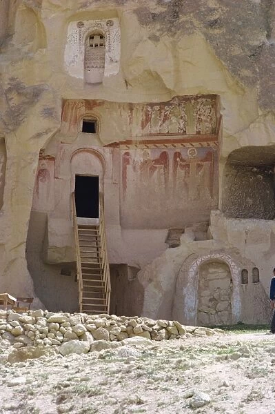 Religious frescoes on outside of a rock cut building