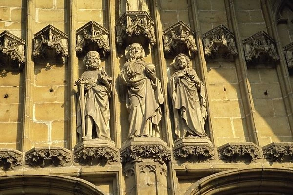 Religious statuary, west door, St. Baafskathedraal, Ghent, Belgium, Europe