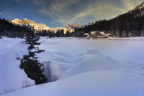 Rendena Valley, Lake Nambino and Brenta mountain range at sunset in winter, Trentino