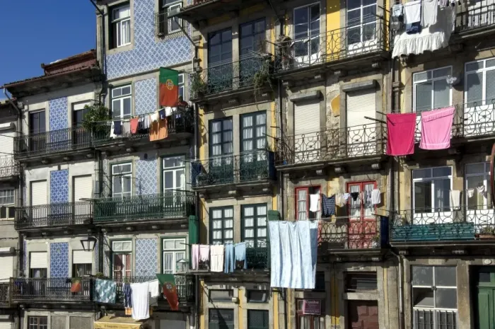 Framed Print : A residential street in the old town with traditional wrought iron balconies, blue and white tiled panels on the outside walls, washing hanging in the sun, Oporto, Portiugal, Europe Framed Print : A residential street in the old town with traditional wrought iron balconies, blue and white tiled panels on the outside walls, washing hanging in the sun, Oporto, Portiugal, Europe