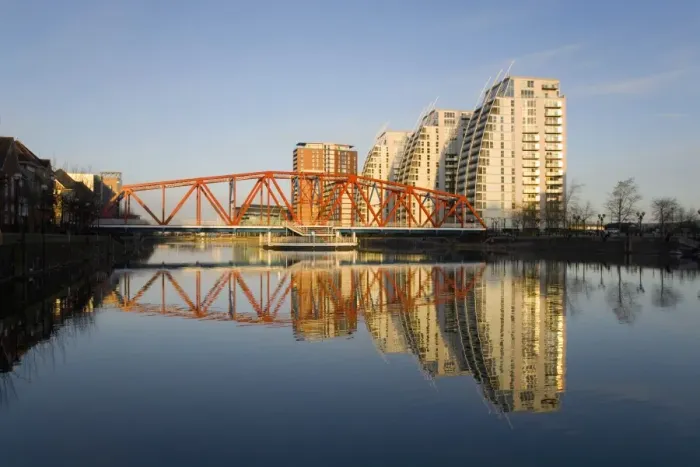 Framed Print : Residential tower blocks and colourful bridge reflected in water, Salford Quays, Salford, Greater Manchester, England, United Kingdom, Europe Framed Print : Residential tower blocks and colourful bridge reflected in water, Salford Quays, Salford, Greater Manchester, England, United Kingdom, Europe
