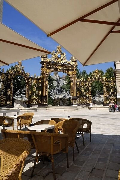 Restaurant and gilded wrought iron gates by Jean Lamor