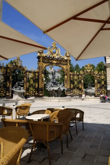 Framed Print : Restaurant and gilded wrought iron gates by Jean Lamor Framed Print : Restaurant and gilded wrought iron gates by Jean Lamor