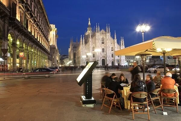 Restaurant in Piazza Duomo at dusk, Milan, Lombardy, Italy, Europe