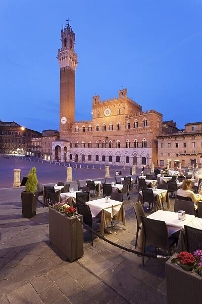 Restauranta at Piazza del Campo with Palazzo Pubblico town hall and Torre del Mangia Tower