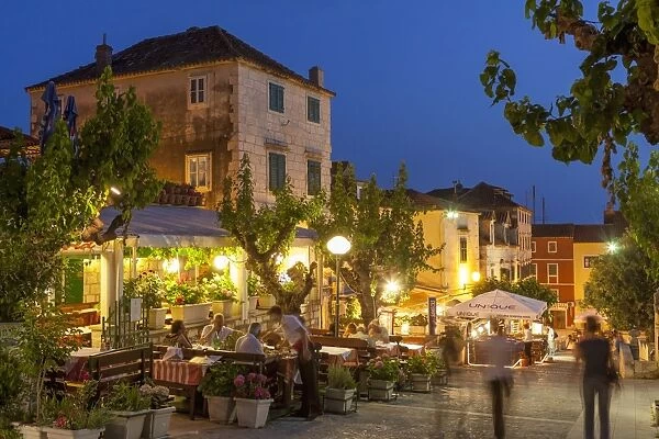 Restaurants at dusk, Makarska, Dalmatian Coast, Croatia, Europe