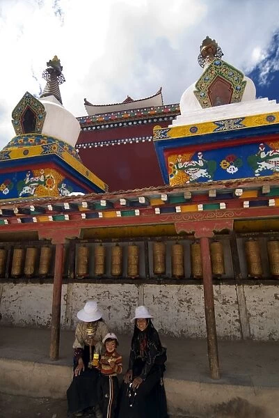 Resting from the sun at temple, Yushu, Qinghai, China, Asia