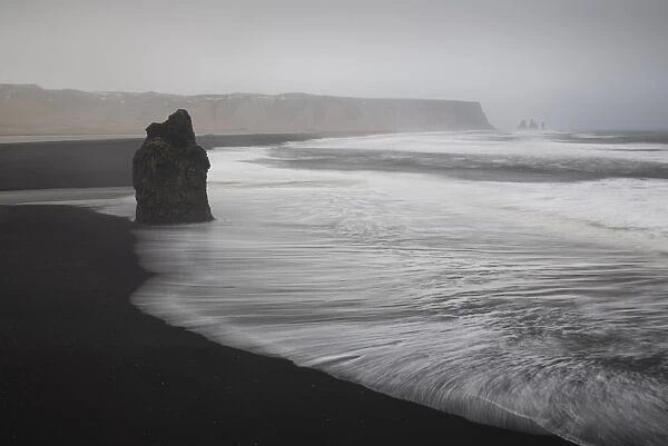 Reynisdrangar basalt rock columns and black sand beach in Vik, Iceland, Polar Regions