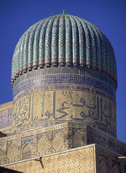 The ribbed dome, tiles and Arabic script on the Bibi Khanym Mosque in Samarkand