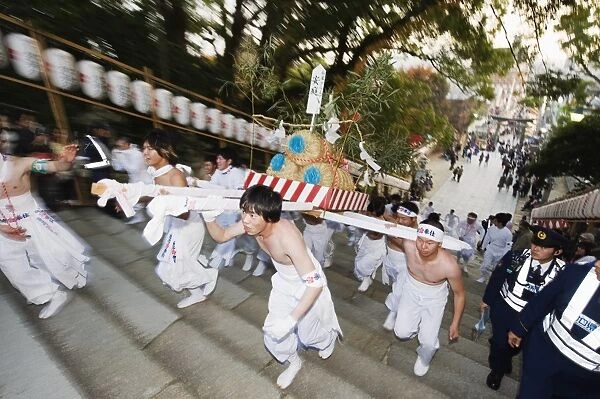 Rice bales being carried at Hadaka Matsuri (Naked Festival), Hofu city