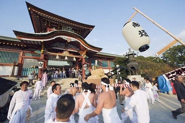Rice bales being carried at Hadaka Matsuri (Naked Festival), Hofu city