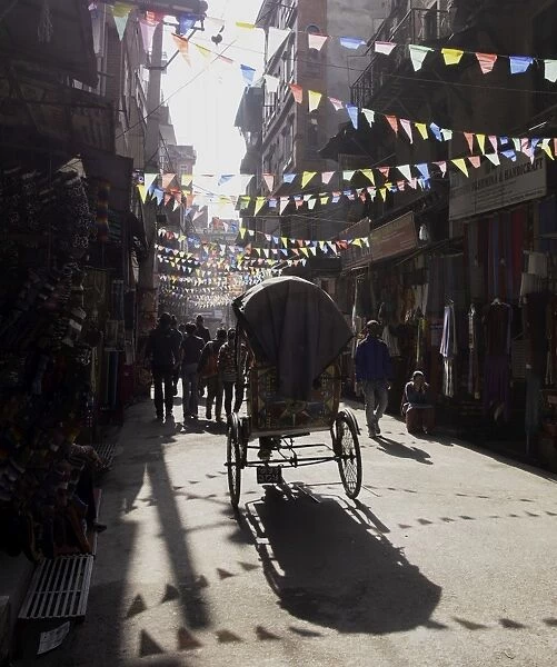 A rickshaw driving through the streets of Kathmandu, Nepal, Asia