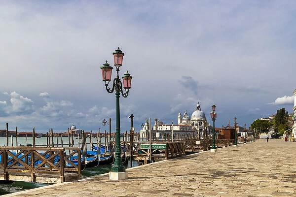 The Riva degli Schiavoni with typical green street lamps and gondola moorings, Venice, UNESCO World Heritage Site, Veneto, Italy, Europe