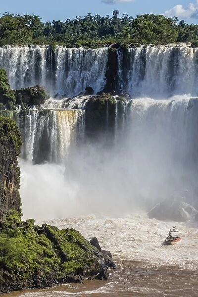 A river boat at the base of the falls, Iguazu Falls National Park, UNESCO World Heritage Site