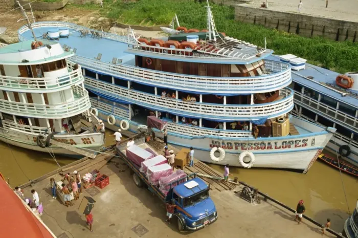 Framed Print : River boats on the quayside being unloaded at Parintins in the Amazon area of Brazil Framed Print : River boats on the quayside being unloaded at Parintins in the Amazon area of Brazil