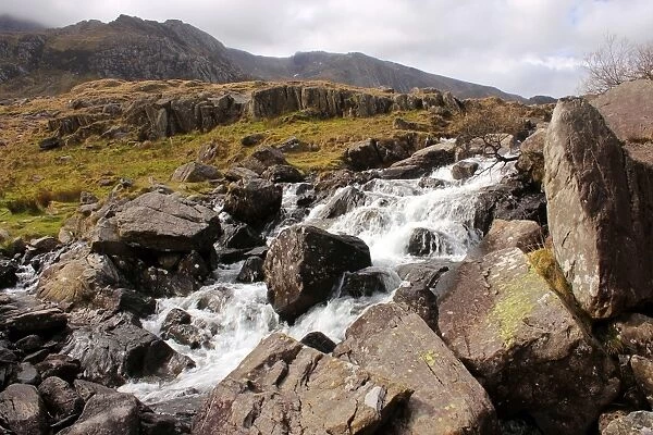 River Idwal drains from Llyn Idwal, in Cwn Idwal before tumbling down the Idwal Falls at Pont Pen-y-benglog, Snowdonia, Wales, United Kingdom, Europe