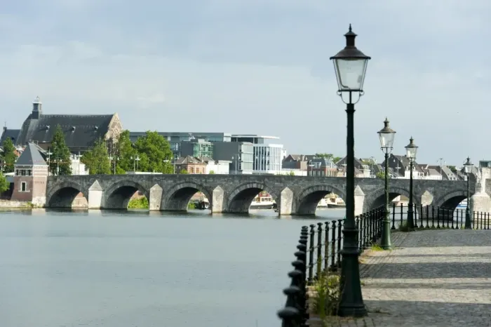 Framed Print : River Ms and Saint Servatius Bridge seen from the Stenenwall (Stone Wall)