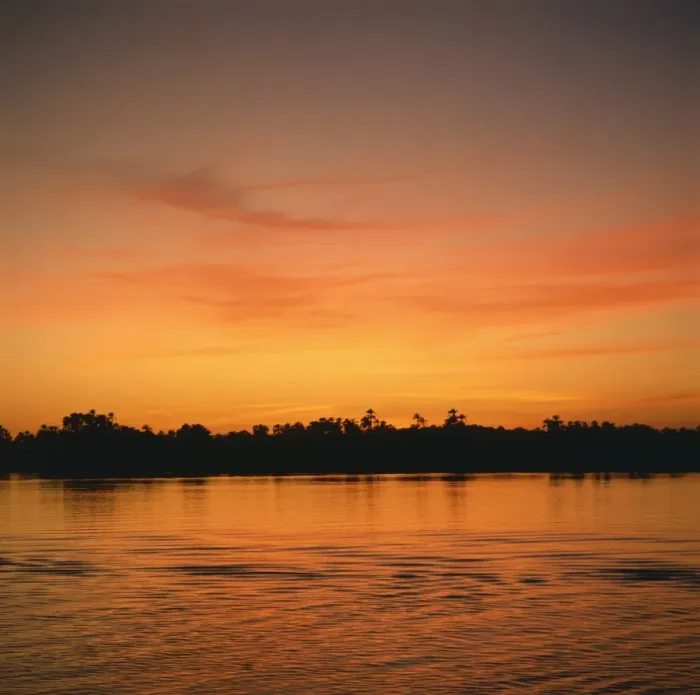 Framed Print : The River Nile at sunset, water reflecting evening sky, in Egypt, North Africa, Africa Framed Print : The River Nile at sunset, water reflecting evening sky, in Egypt, North Africa, Africa