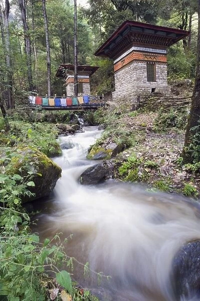 River running through stone cairns on a trail to the Tigers Nest (Taktsang Goemba)