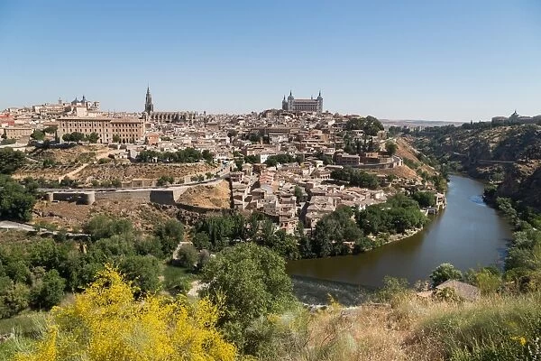 The River Tagus with the Alcazar and cathedral towering above the rooftops of Toledo