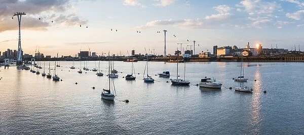 River Thames at sunset and the Emirates Air Line Cable Car, East London, England