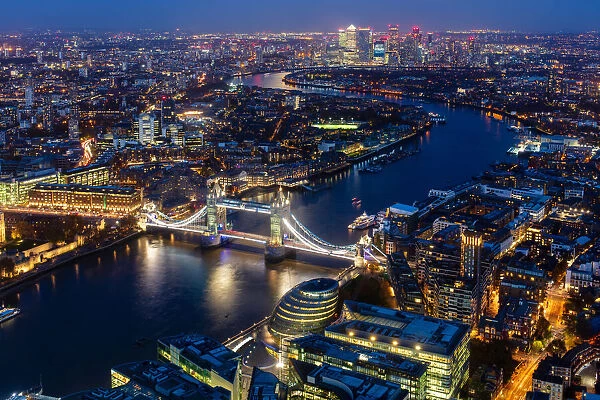 River Thames, Tower Bridge and Canary Wharf from above at dusk, London, England