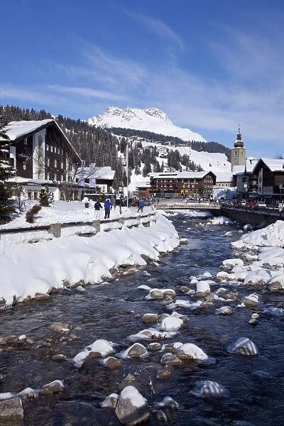 River and village church Lech, near St. Anton am Arlberg in winter snow