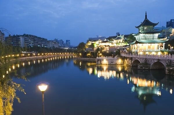 A riverside pavilion illuminated at night in Guiyang city, Guizhou Province, China, Asia