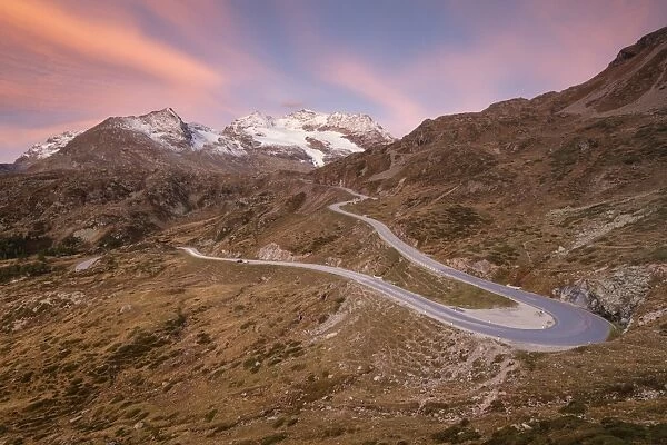 Road bends of Bernina Pass at dawn, Poschiavo Valley, Engadine, Canton of Graubunden