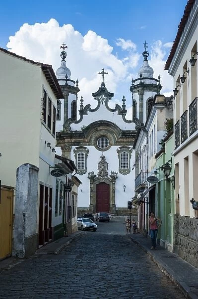 Road with colonial buildings leading to the Nossa Senhora do Carmo church in Sao Joao del Rei, Minas Gerais, Brazil, South America