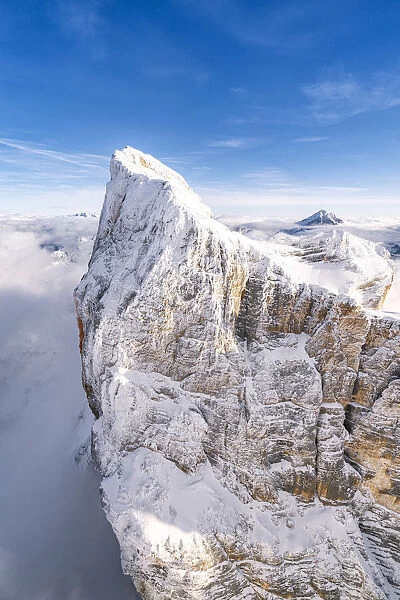 Rock face of Monte Pelmo covered with snow, aerial view, Dolomites, Belluno province