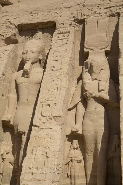 Rock-hewn statues of Ramses II on left, and Queen Neferatri on right, Hathor Temple