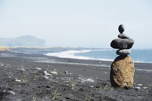 Rock piles and coastal scenery, Vik, Southern Region, Iceland, Polar Regions