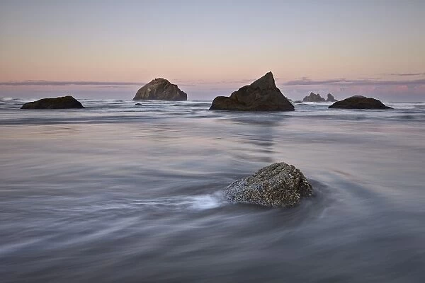 Rock, sea stacks and waves at dawn, Bandon Beach, Oregon, United States of America, North America