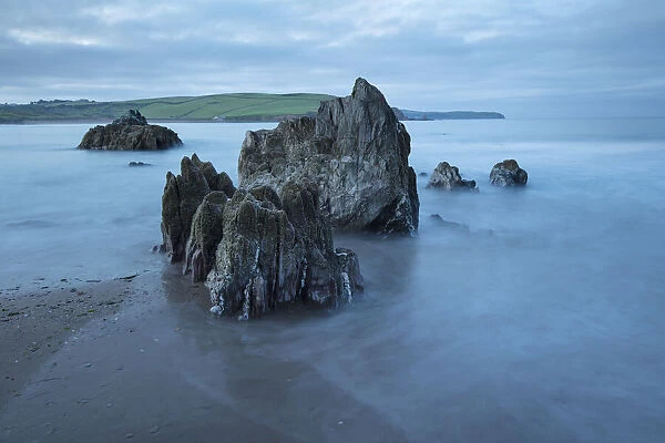 Rocks on beach at low tide at dawn, Bigbury-on-Sea, Devon, England, United Kingdom