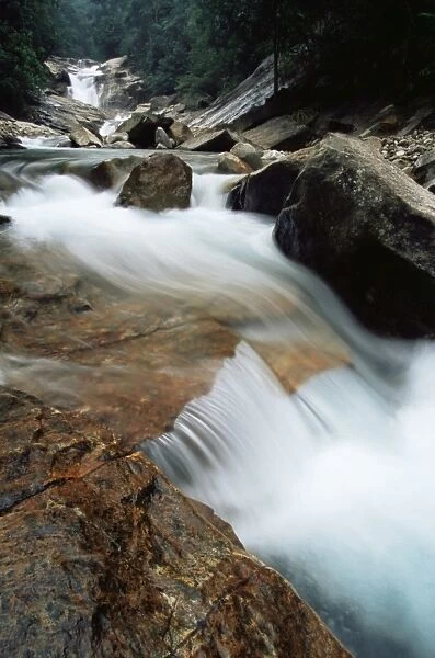 Rocks in fast flowing stream