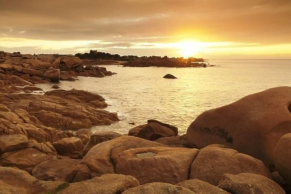 Rocks at the path Sentier des Douaniers on the Cote de Granit Rose at sunset, Cotes d Armor, Brittany, France, Europe