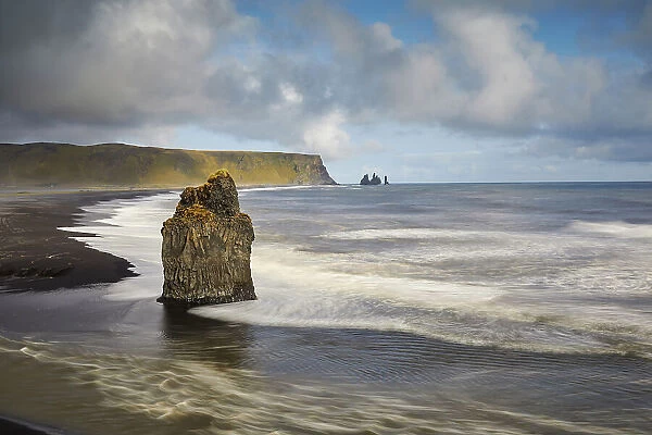 A rocky Atlantic shoreline on Dyrholaey Island, looking towards Reynisfjara beach, near Vik, south coast of Iceland, Polar Regions