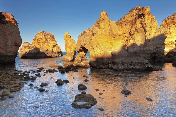 Rocky coast at sunset, Ponta da Piedade Cape, near Lagos, Algarve, Portugal, Europe