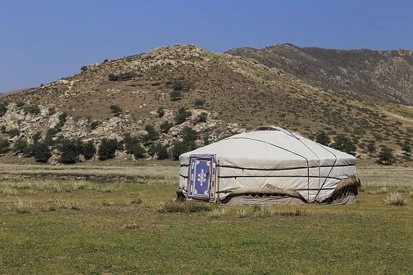 Rocky mountains behind ger, Nomad camp in summer, Khogno Khan Uul Nature Reserve