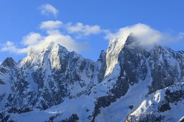 Rocky peaks Badile and Cengalo covered with snow in spring, Soglio, Bregaglia Valley
