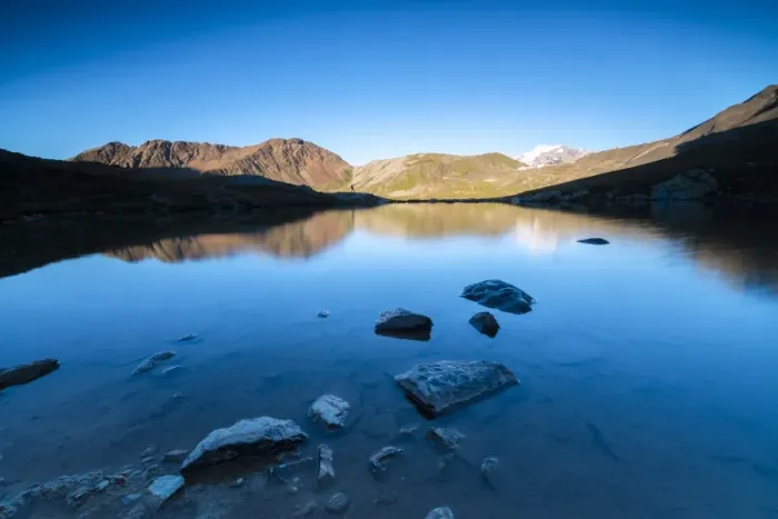 Framed Print : The rocky peaks reflected in Lake Umbrail at sunset, Stelvio Pass, Valtellina, Lombardy Framed Print : The rocky peaks reflected in Lake Umbrail at sunset, Stelvio Pass, Valtellina, Lombardy