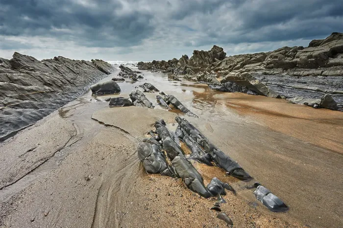 Framed Print : A rocky shore at low tide and under grey skies; at Welcombe Mouth, Hartland, north Devon, England, United Kingdom, Europe Framed Print : A rocky shore at low tide and under grey skies; at Welcombe Mouth, Hartland, north Devon, England, United Kingdom, Europe