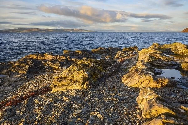 Rocky shore near Catacol looking out across the Kilbrannan Sound to Mull of Kintyre