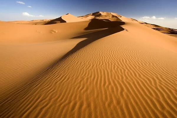 Rolling orange sand dunes and sand ripples in the Erg Chebbi sand sea near Merzouga