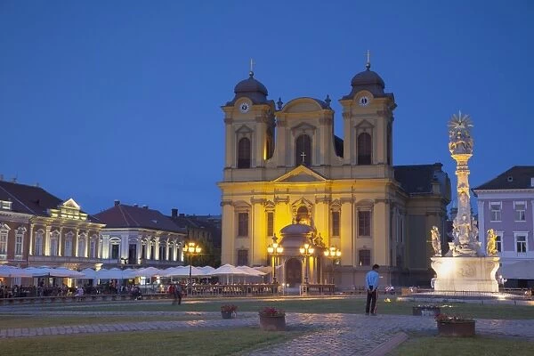 Roman Catholic Cathedral and Trinity Column in Piata Unirii at dusk, Timisoara, Banat, Romania, Europe